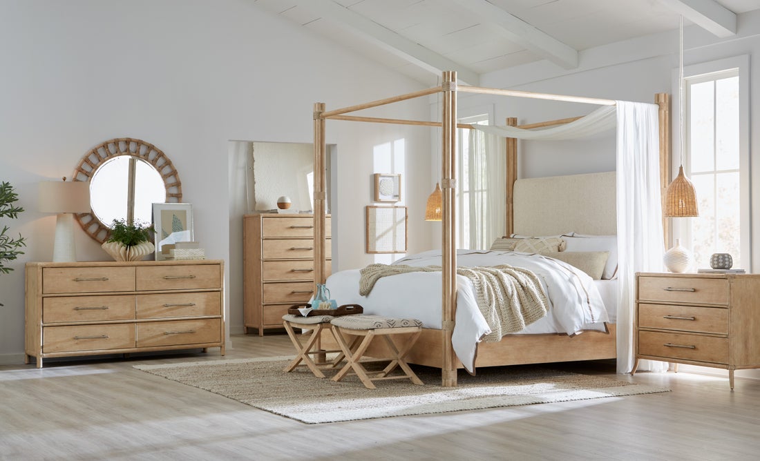 a bedroom with a bed, dresser and mirror