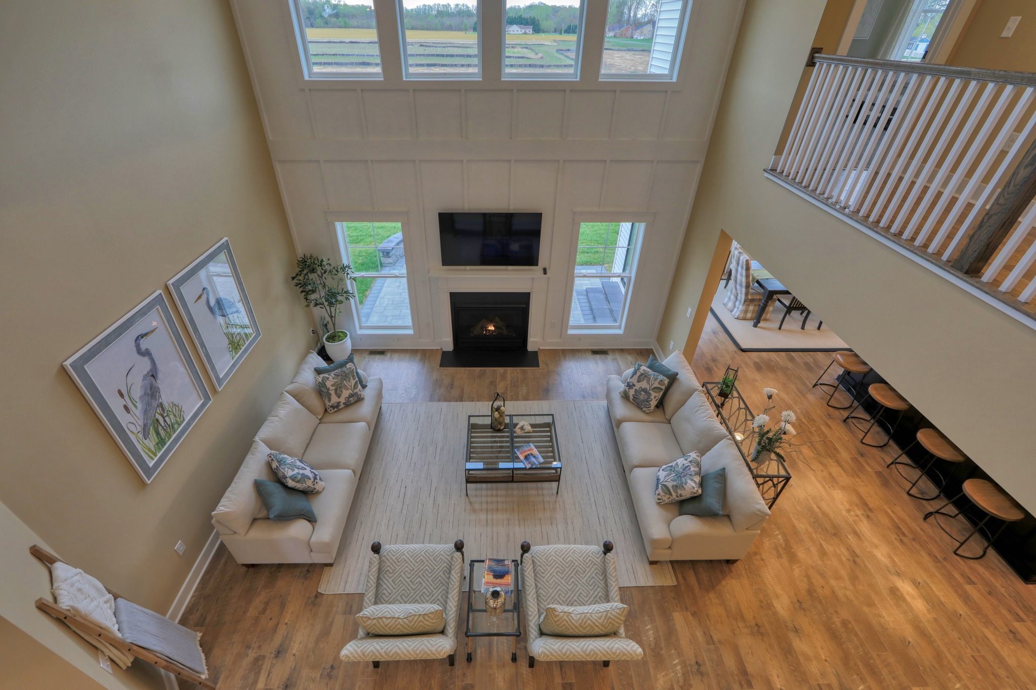 an aerial view of a living room and dining room