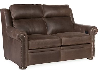 a brown leather couch with studded arms