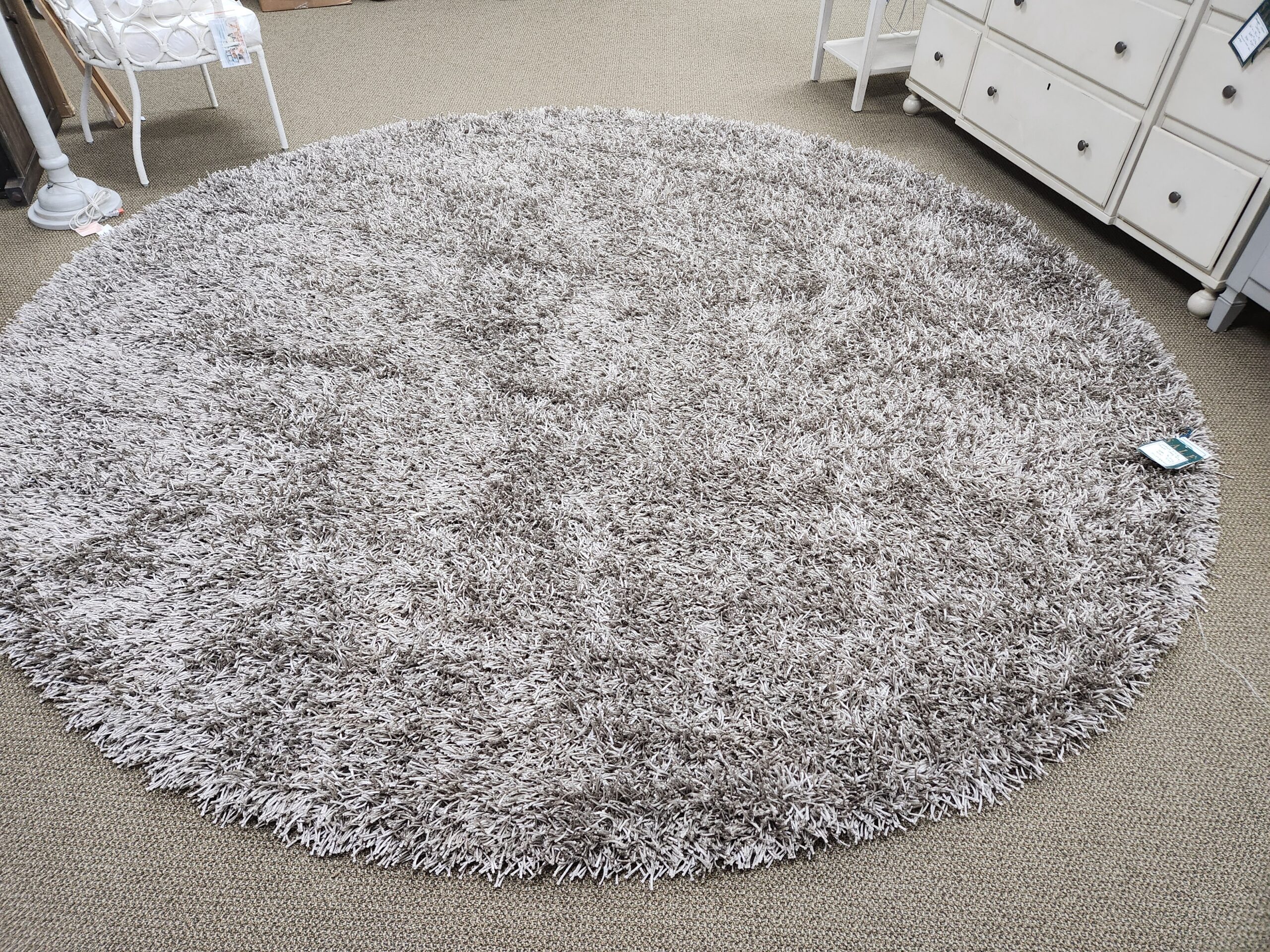a large round rug on the floor in a room