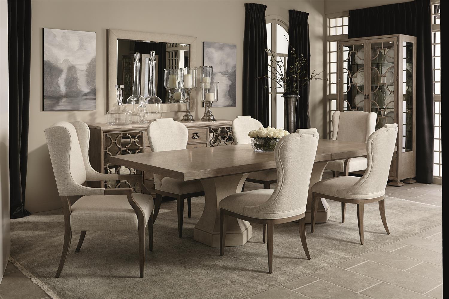 a dining room table and chairs with white upholstered chairs