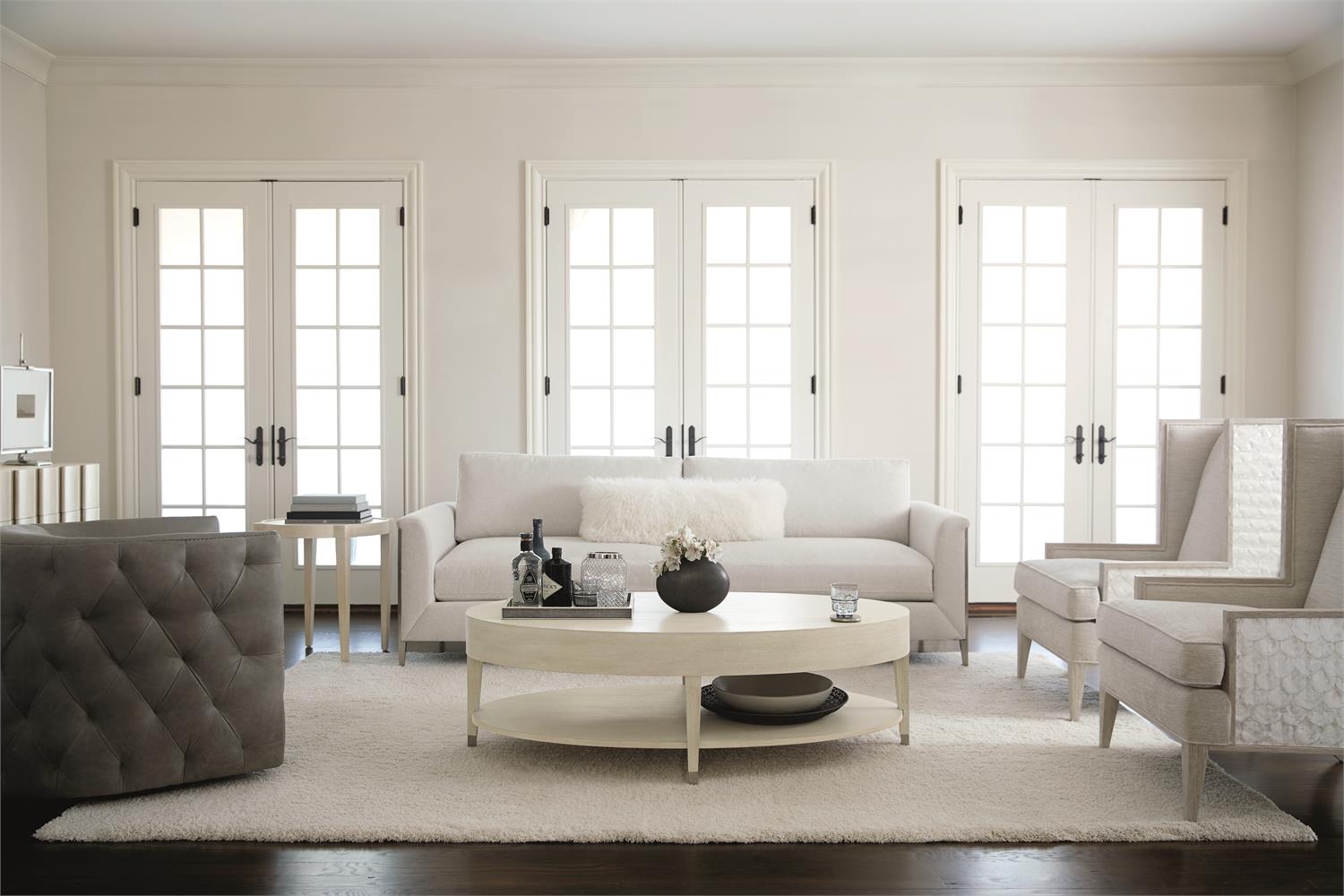 a living room filled with furniture and white walls