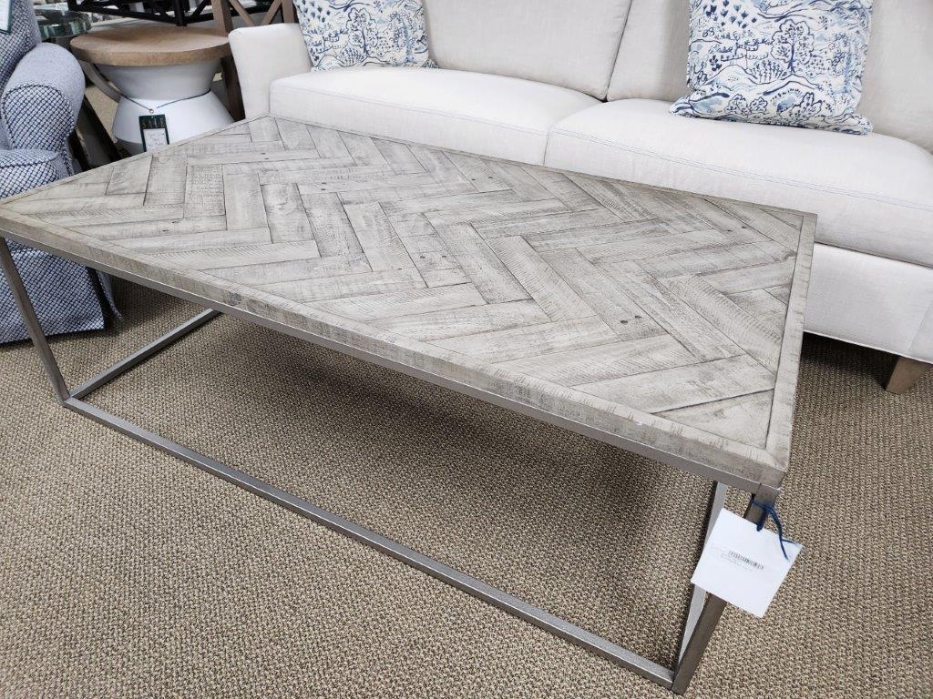 a coffee table sitting on top of a carpeted floor