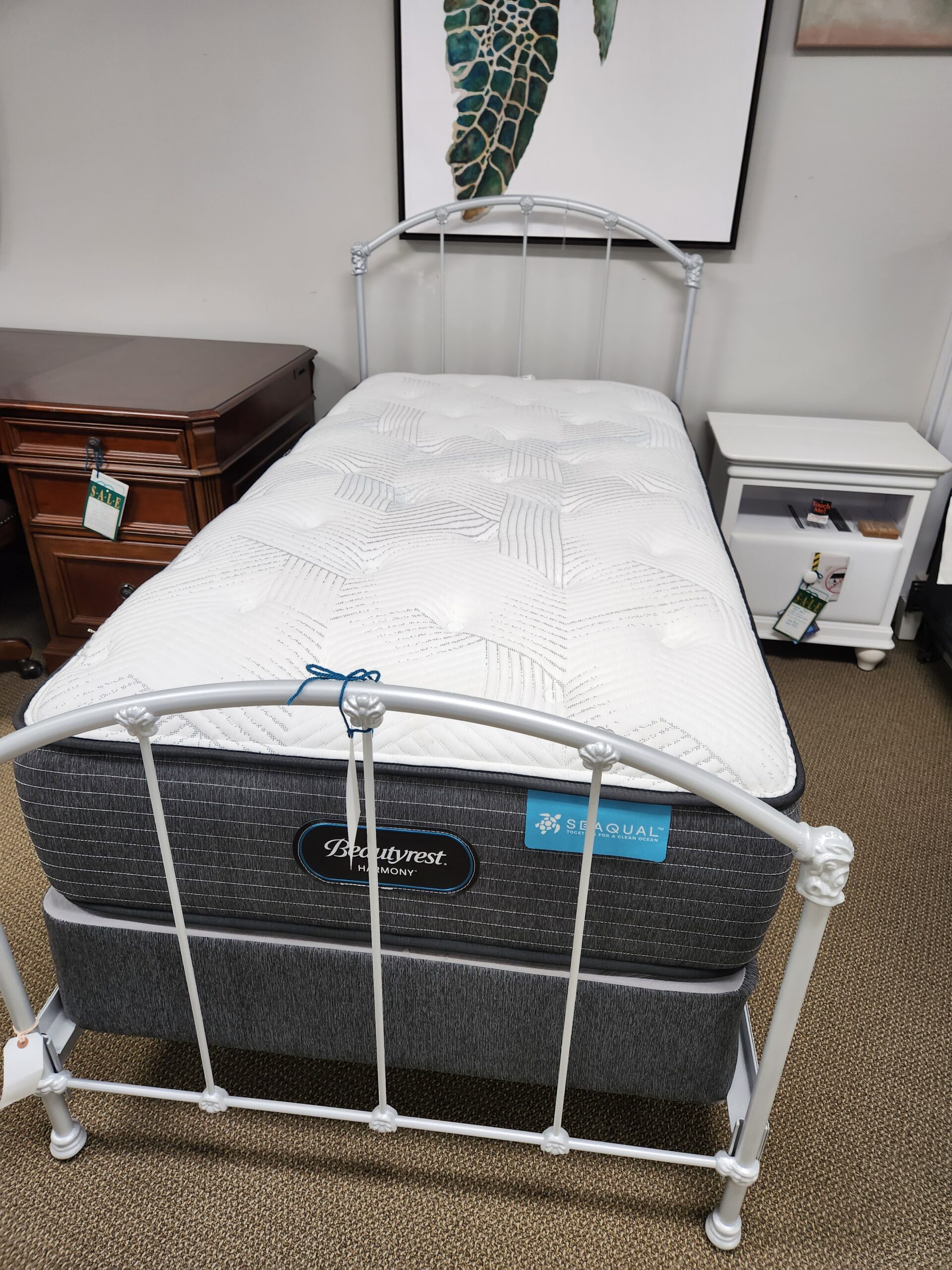 a bed frame with a mattress attached to it