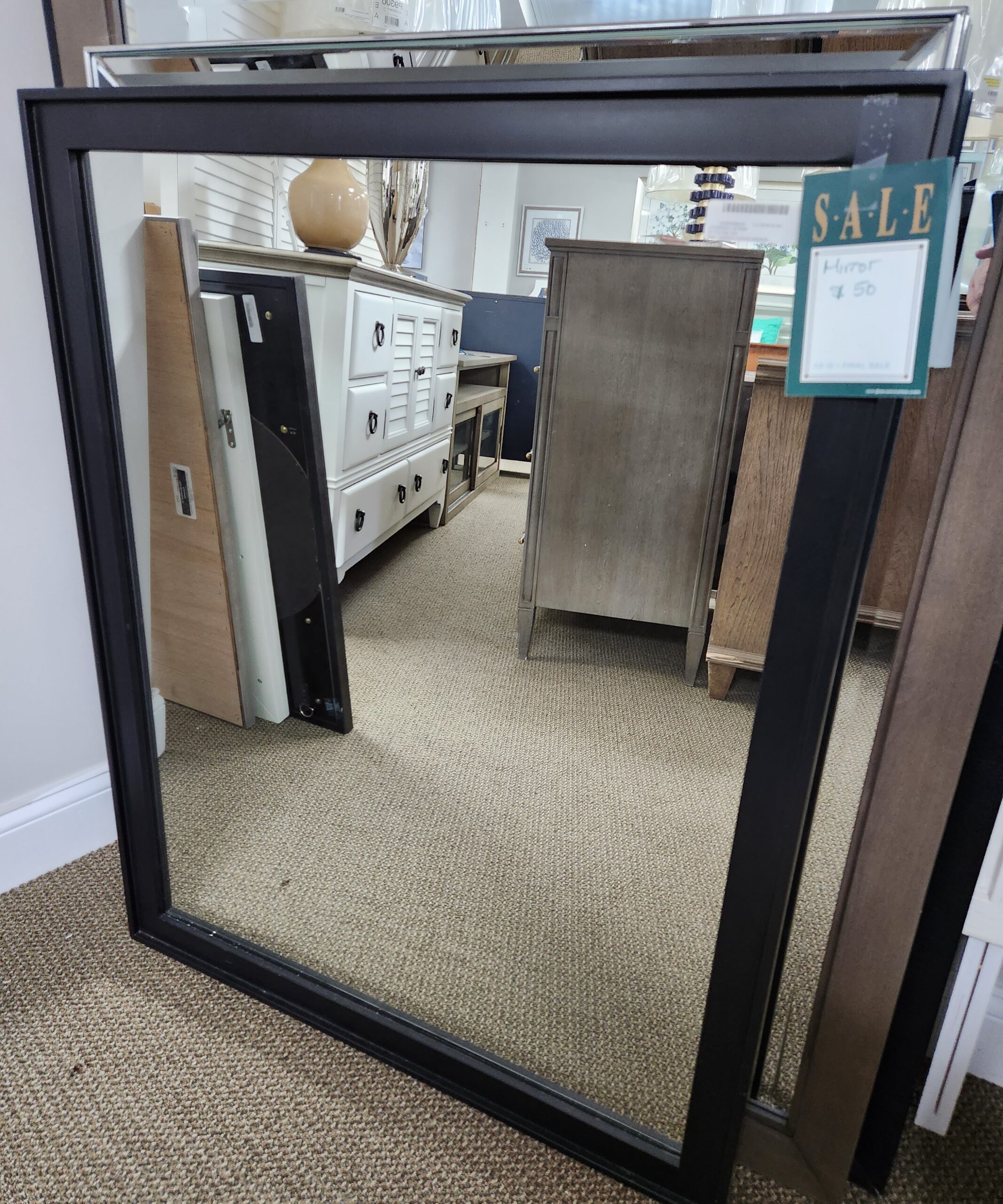 a mirror with a reflection of a keyboard