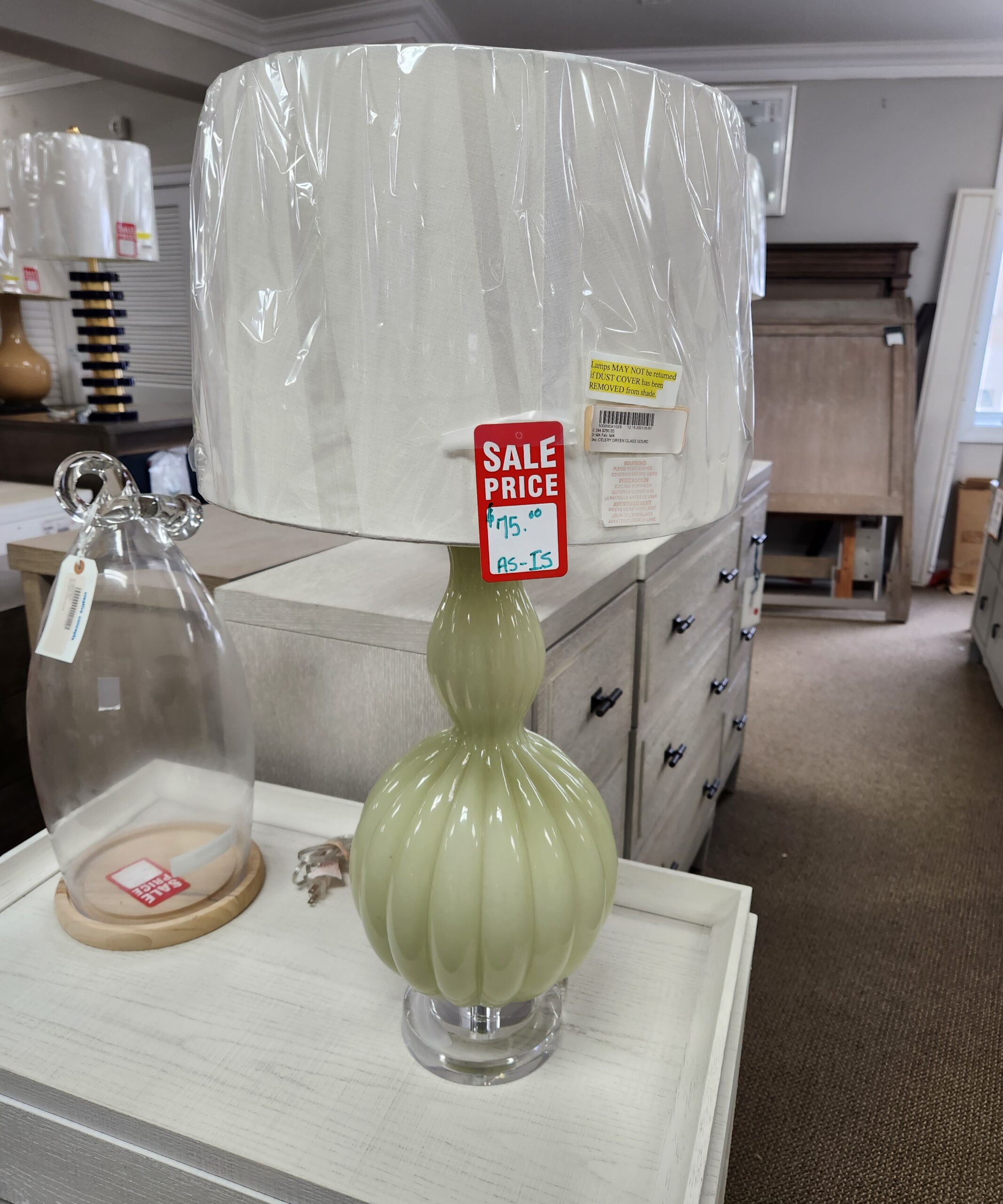 a green lamp sitting on a table