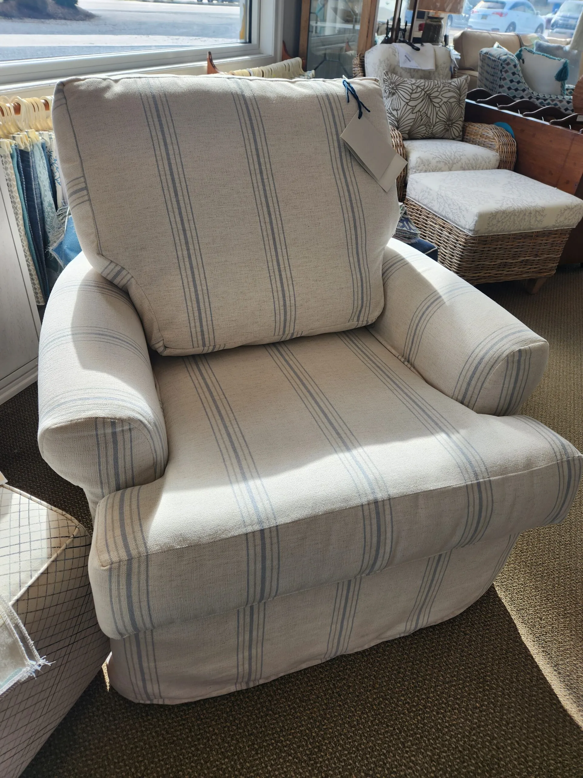 a recliner chair sitting in a living room next to a window