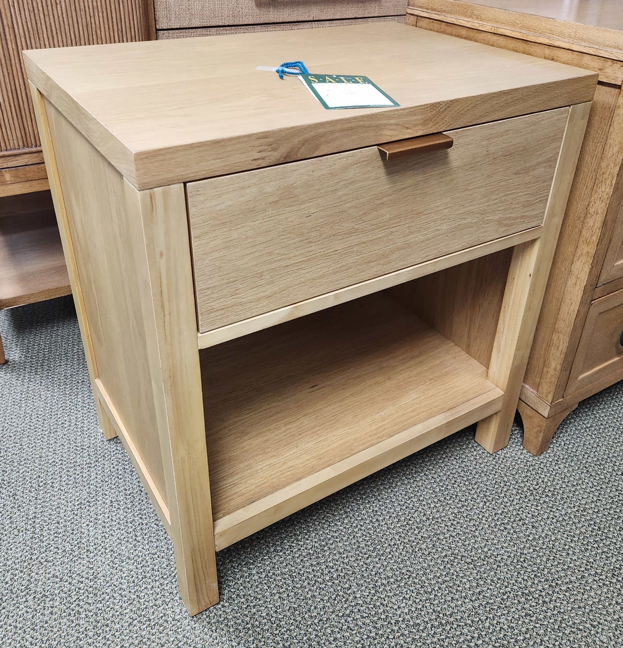 a wooden table with a drawer on top of it