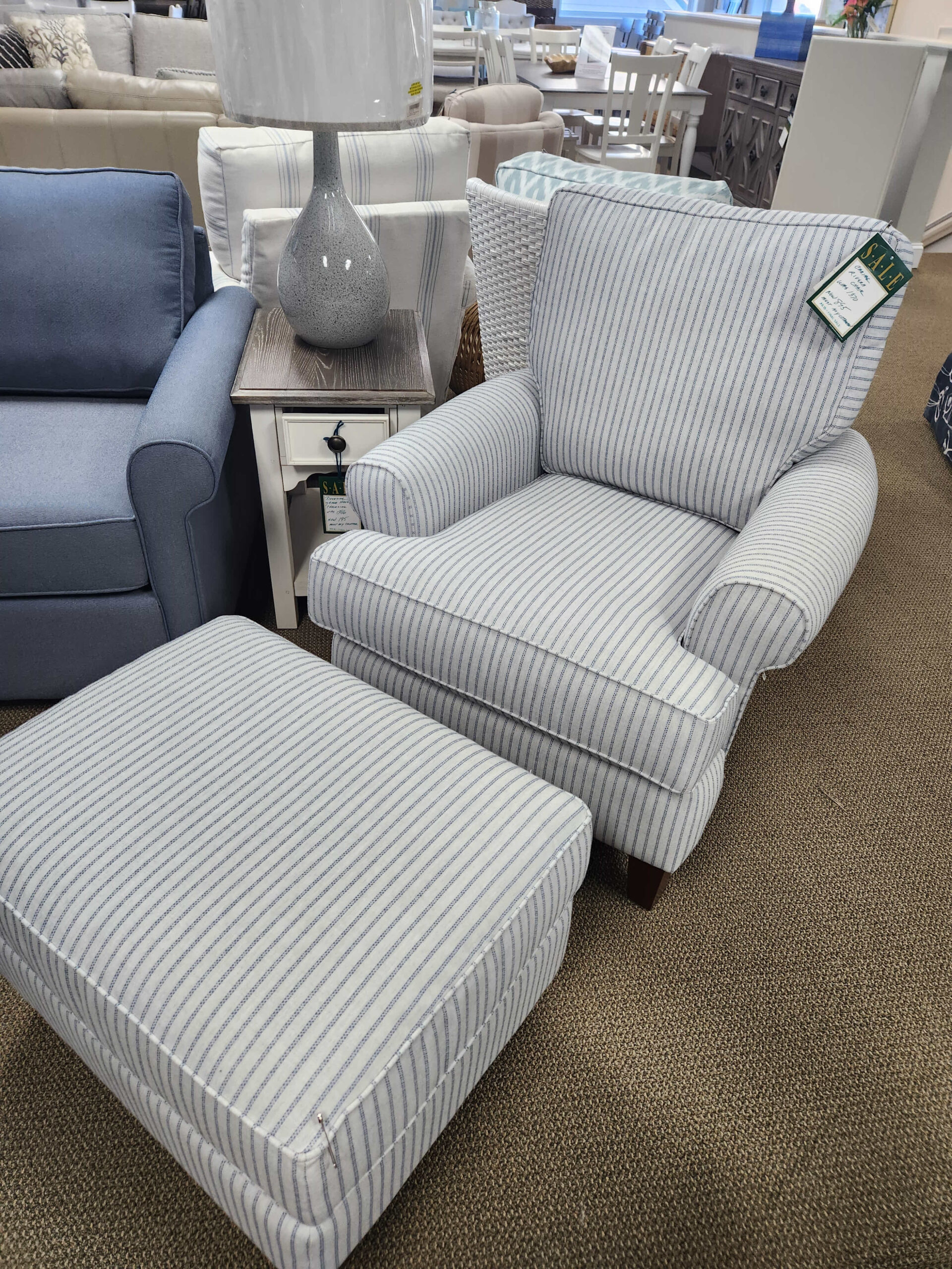 a row of couches and chairs in a store