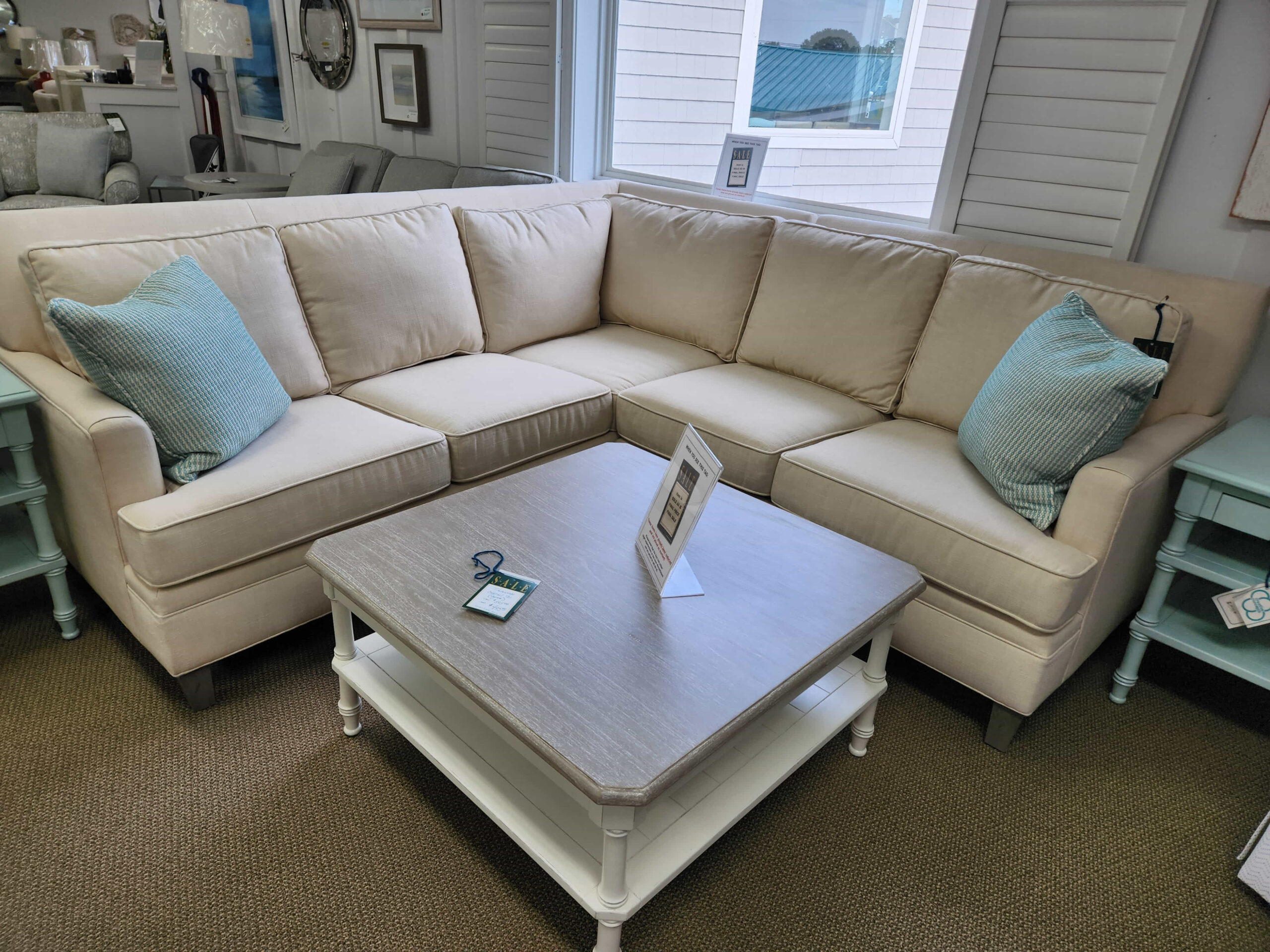 a living room filled with furniture and a large window