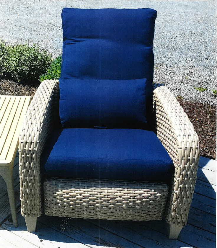 a chair with a blue cushion sitting on a deck