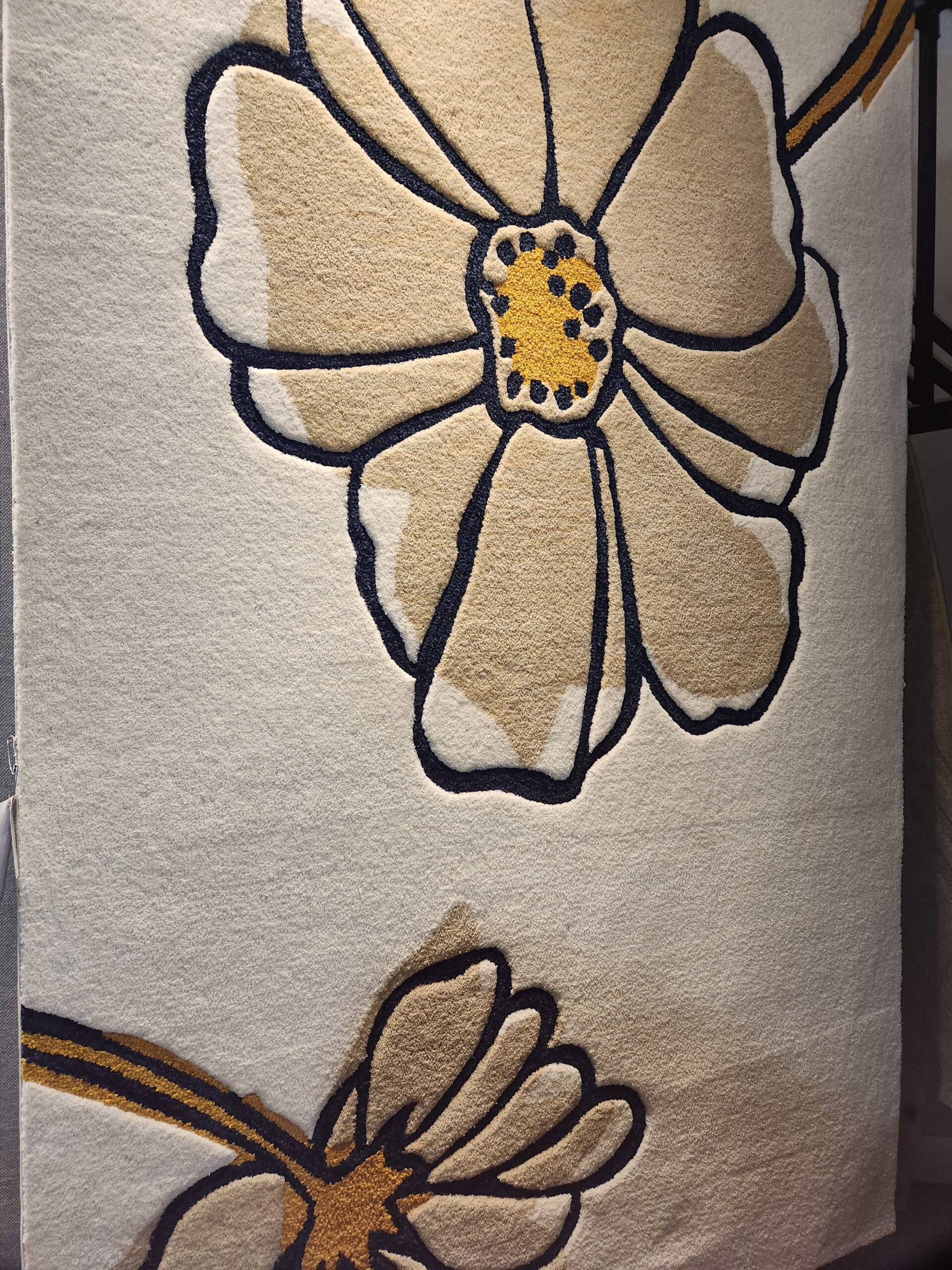 a close up of a towel with a flower on it