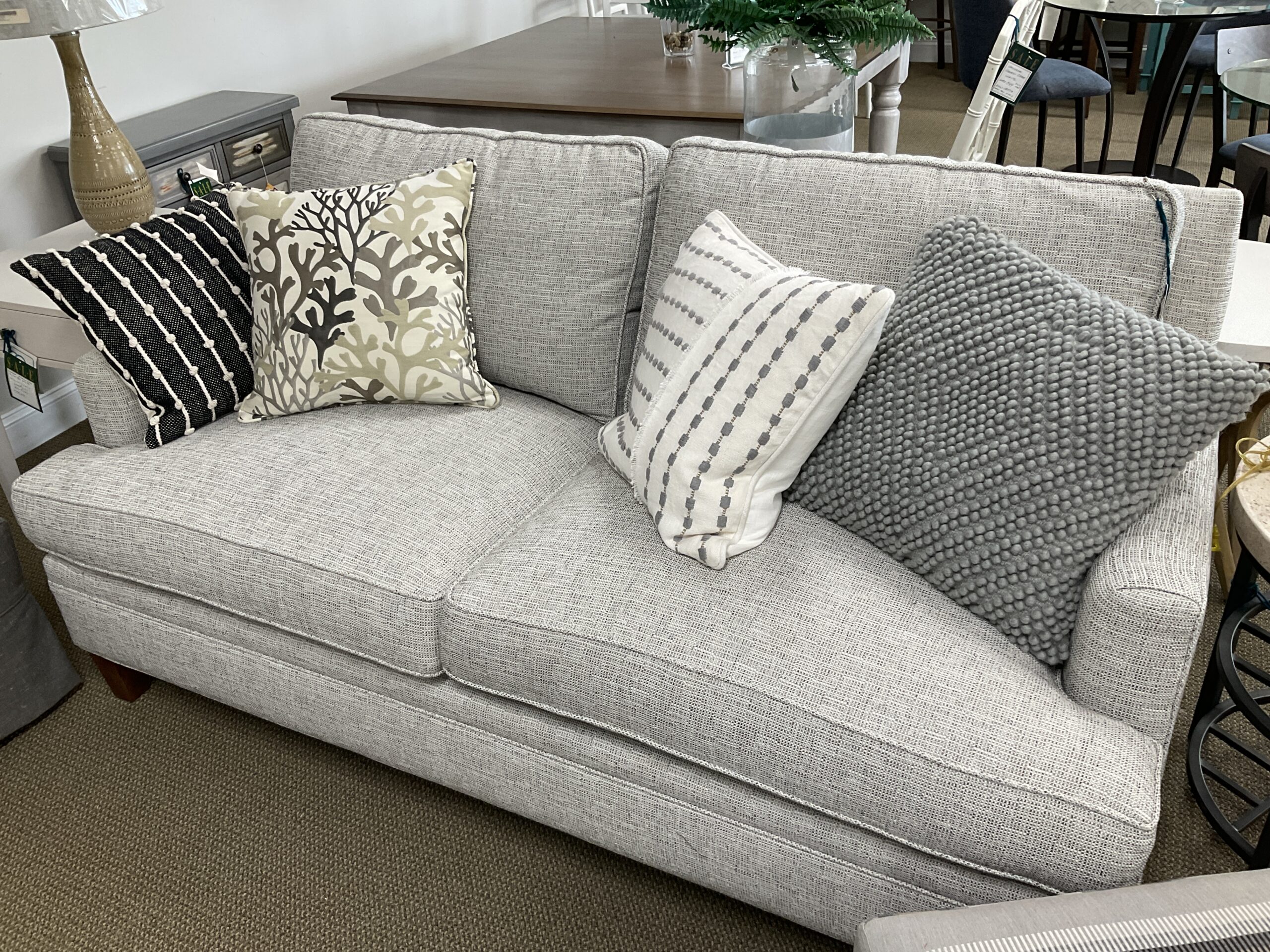 a living room filled with furniture and decor