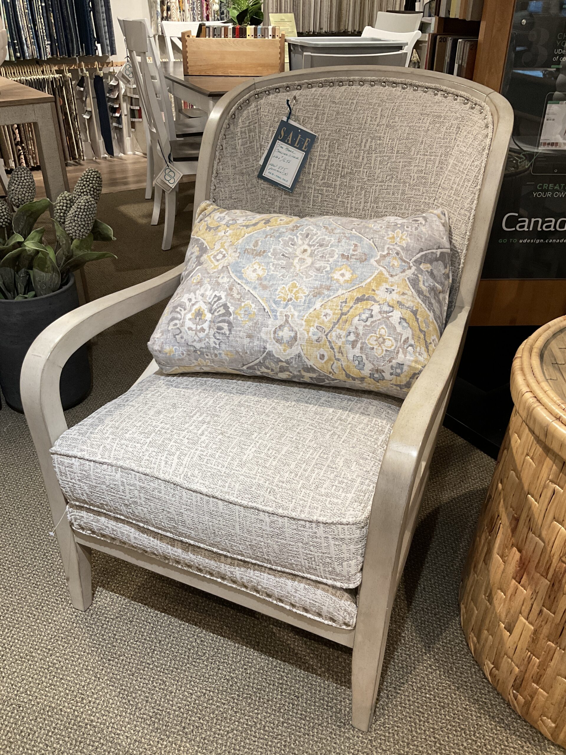 a chair with pillows and a basket on it