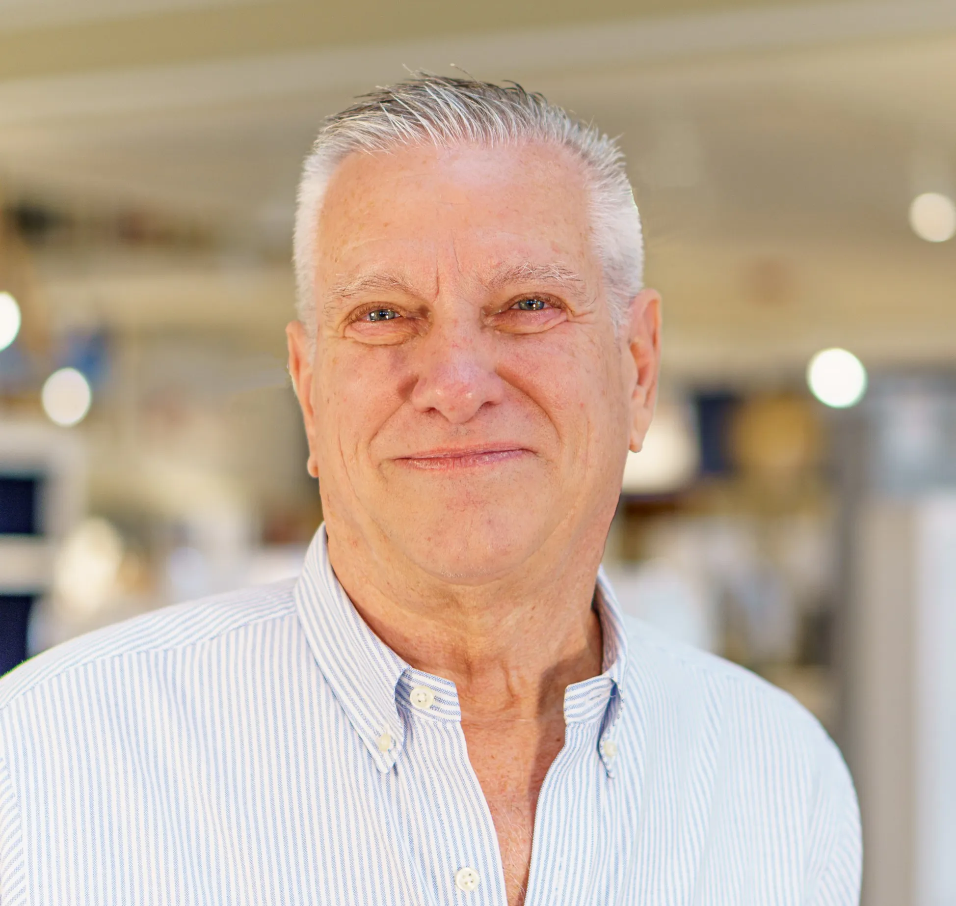 a man in a blue and white striped shirt