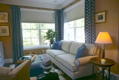 a living room filled with furniture and a window