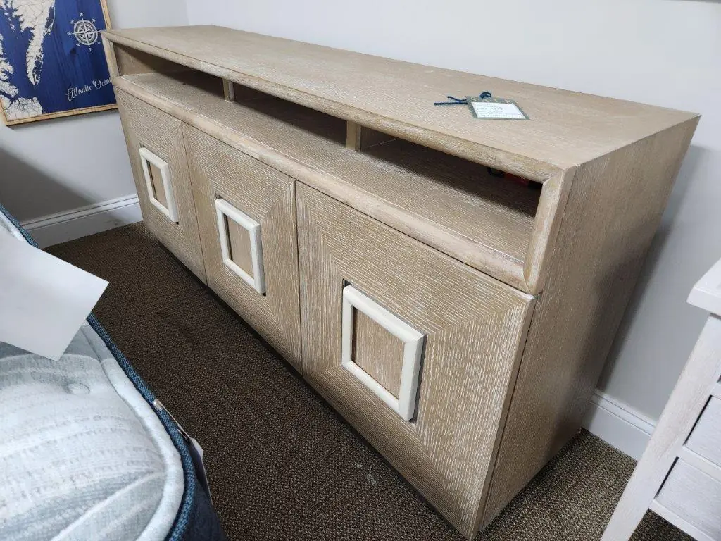 a close up of a wooden cabinet in a room